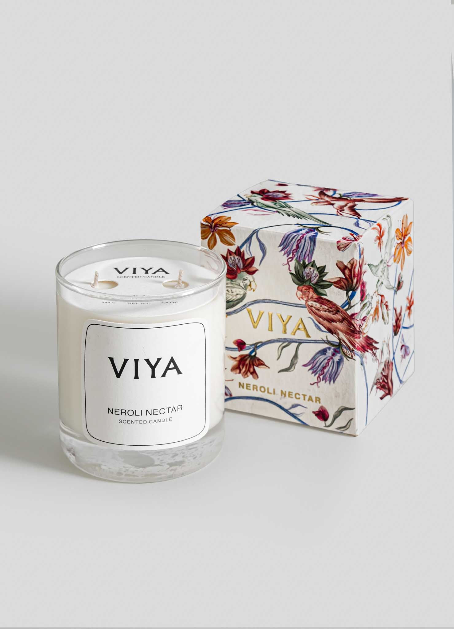 VIYA candle and its packaging on a light gray background viya luxury wax candle stand
