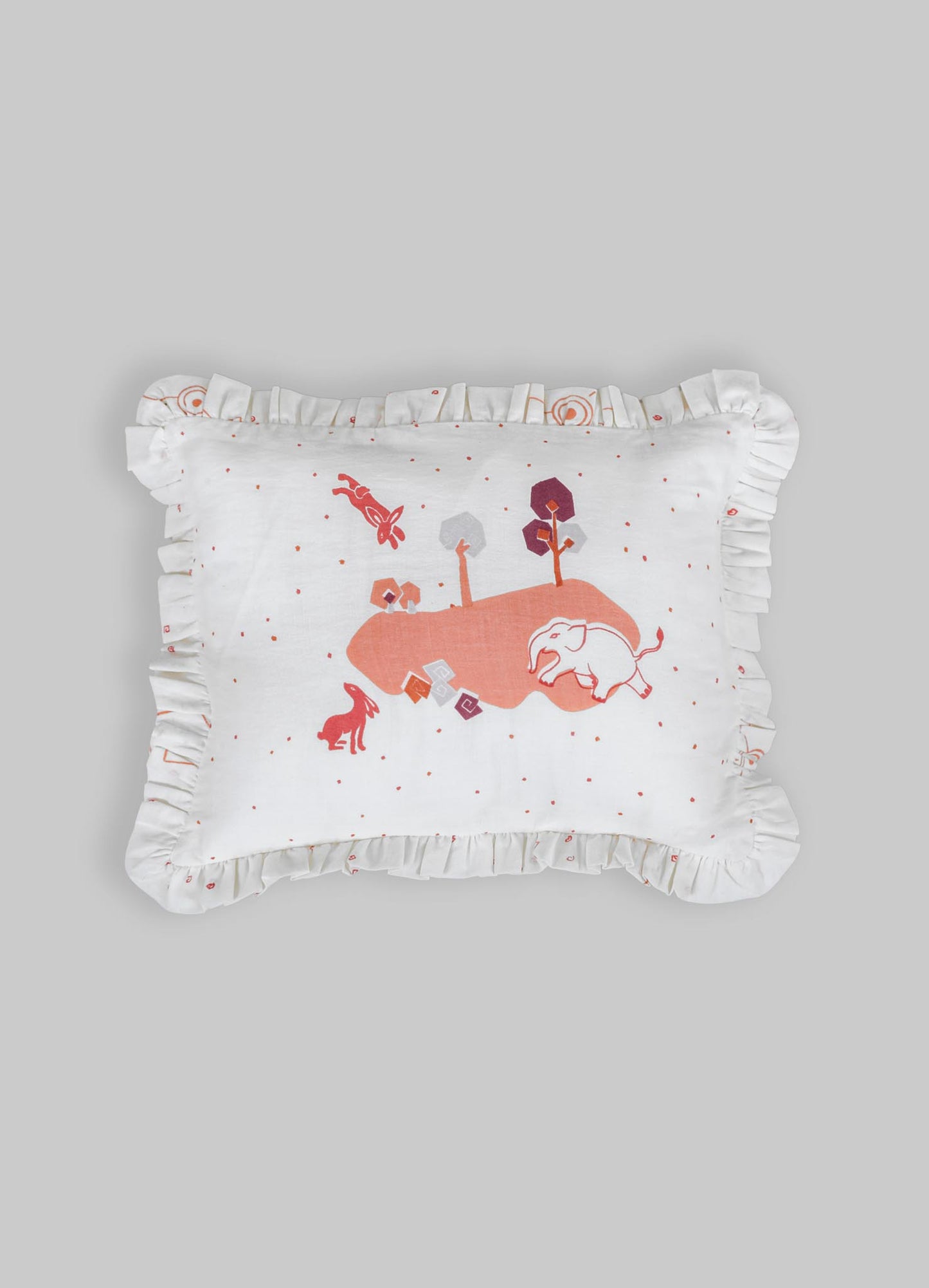 Decorative cushion with white fabric, featuring embroidered animal and nature motifs in shades of orange, pink, purple, and gray. The cushion has a ruffled trim around the edges, adding a soft, whimsical touch.