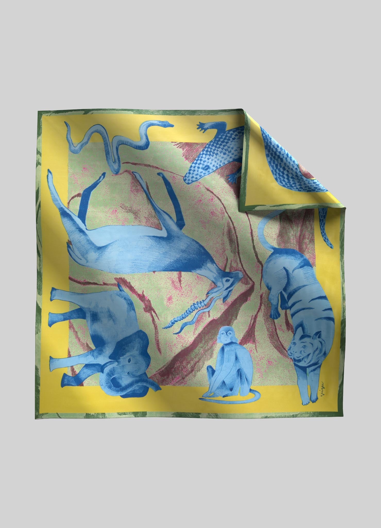 A silk scarf featuring a vibrant, multicolored design with blue animal motifs, including a tiger, monkey, elephant, and lizard, set against a yellow and pink background. The style is contemporary with a playful, artistic motif.