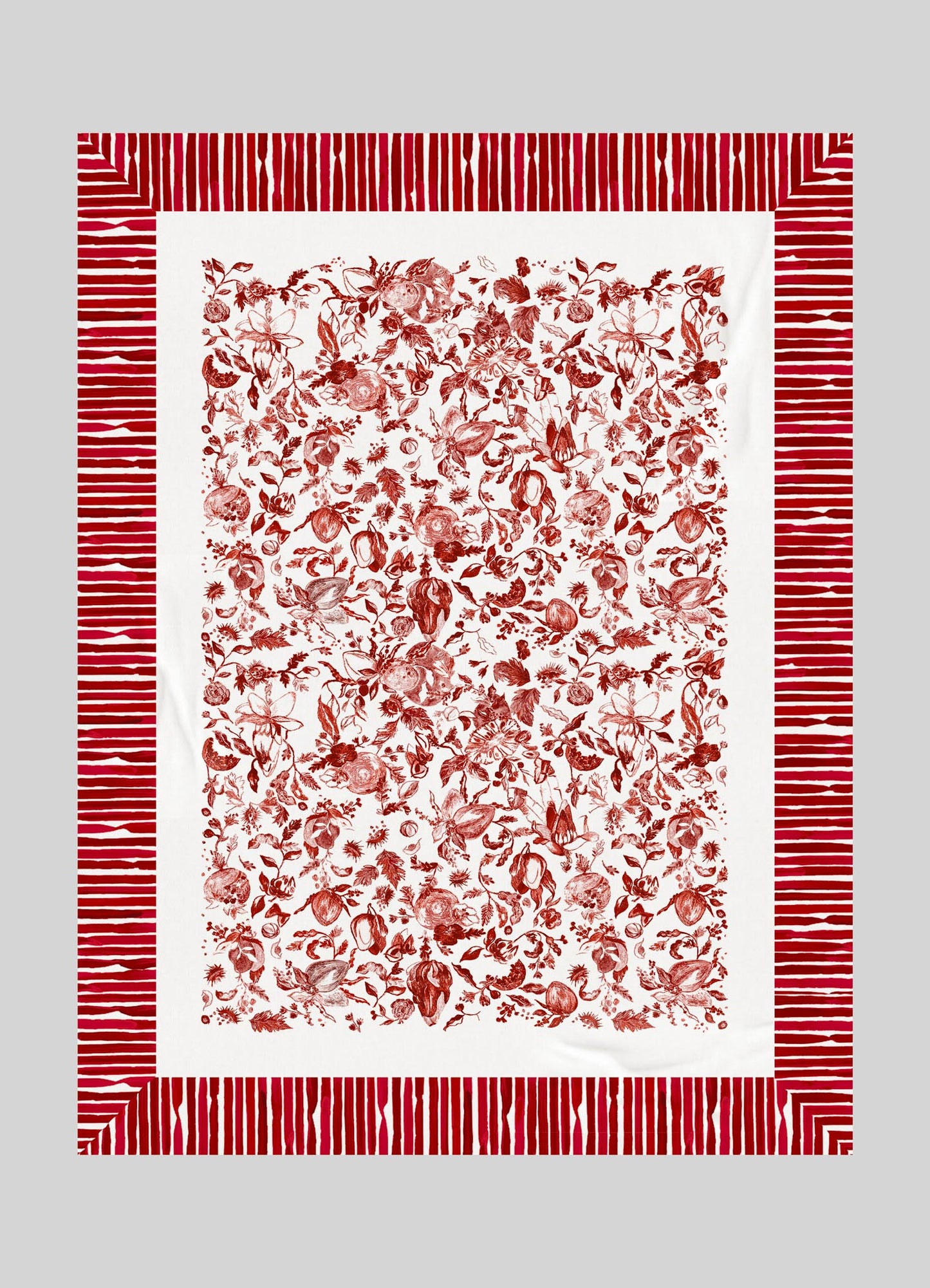 A decorative textile with a white background featuring a detailed red floral and fruit pattern in the center, bordered by a red and white striped frame.