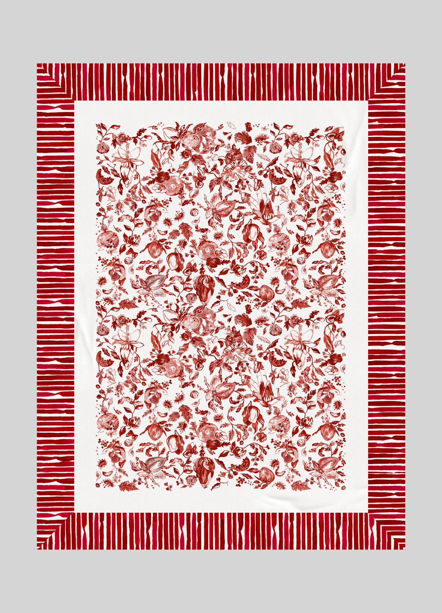 A decorative textile with a white background featuring a detailed red floral and fruit pattern in the center, bordered by a red and white striped frame.
