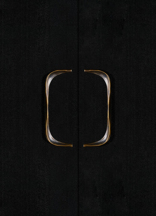 Black textured cabinet doors with metallic gold and silver curved handles.