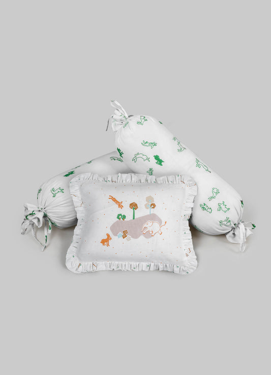 Decorative baby bedding set featuring a cylindrical pillow and a square pillow with ruffled edges, made of soft white fabric with embroidered animal and nature motifs in green, orange, and brown. The set includes a tied bolster with matching embroidered patterns, designed with a playful and natural theme suitable for nursery decor.
