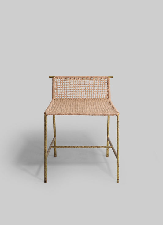 A chair with a metal frame and a woven rattan seat and backrest, featuring a natural beige tone and a minimalist design. The metal legs have a textured finish, adding a rustic touch to the contemporary aesthetic.