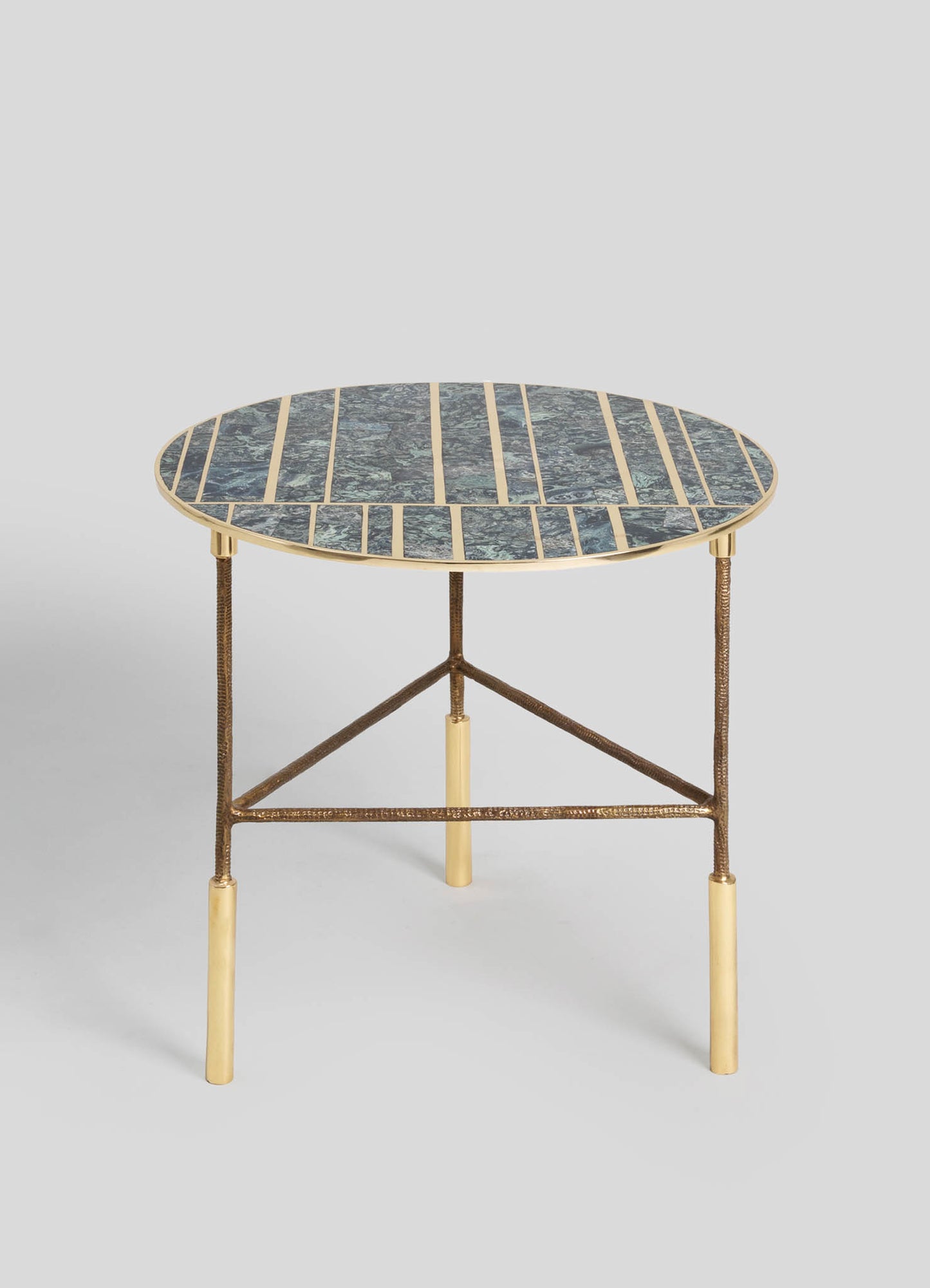 A round side table with a mosaic glass top featuring shades of blue and green, framed by a gold metal edge. The table has a textured bronze-finished metal tripod base with gold accents on the legs.