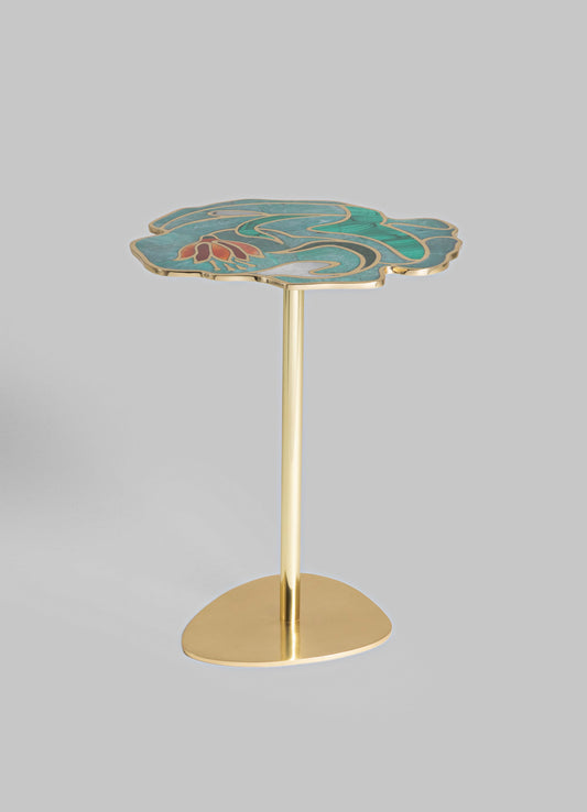 A side table with a metal gold base and a decorative tabletop featuring a floral motif in teal, orange, and white shades, with a scalloped edge.