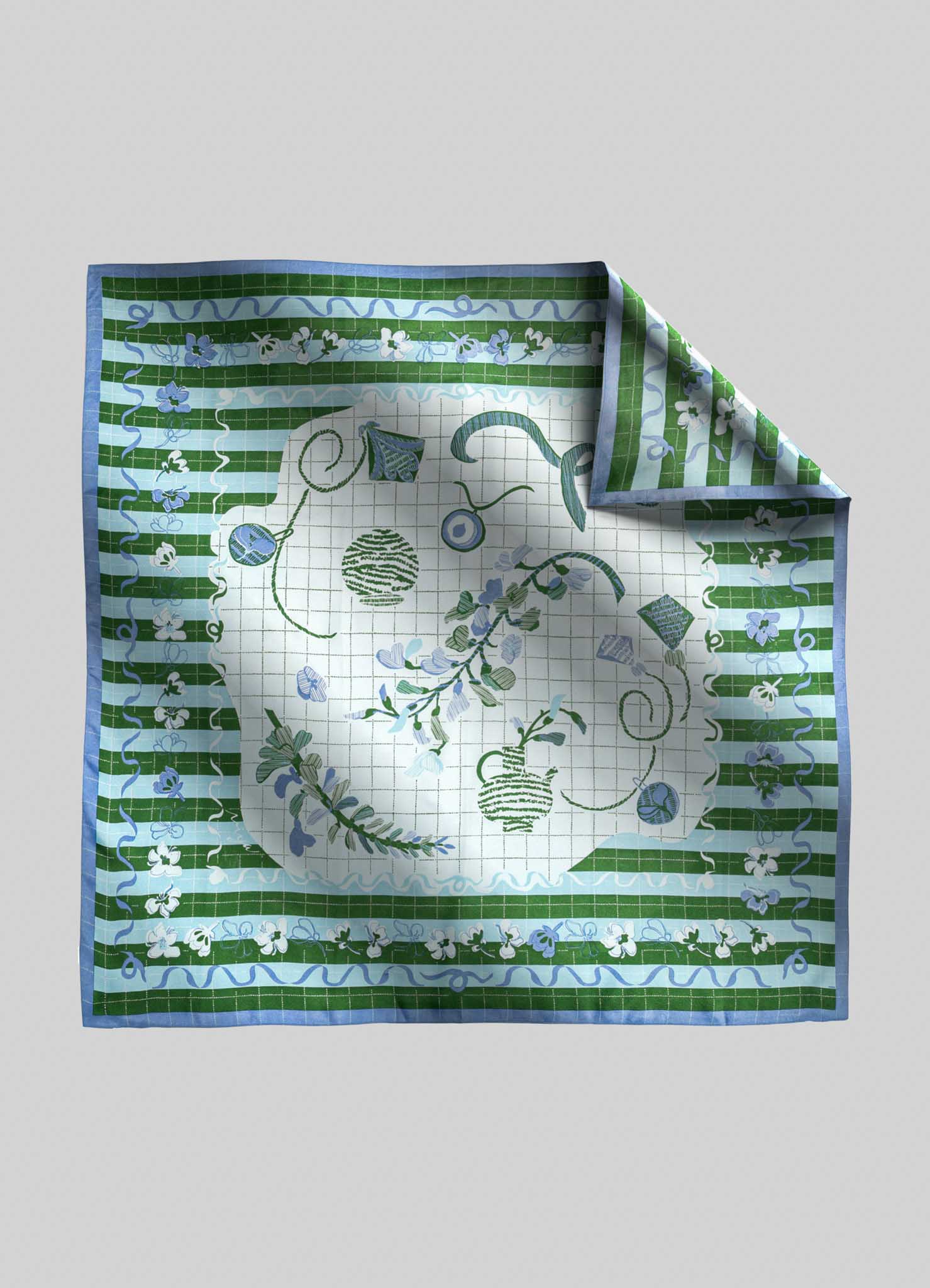 A square handkerchief featuring a floral and geometric pattern in shades of green, blue, and white, with a central motif of stylized plants and abstract shapes. The fabric appears to be lightweight cotton or linen, with a decorative border and a folded corner revealing the underside pattern.