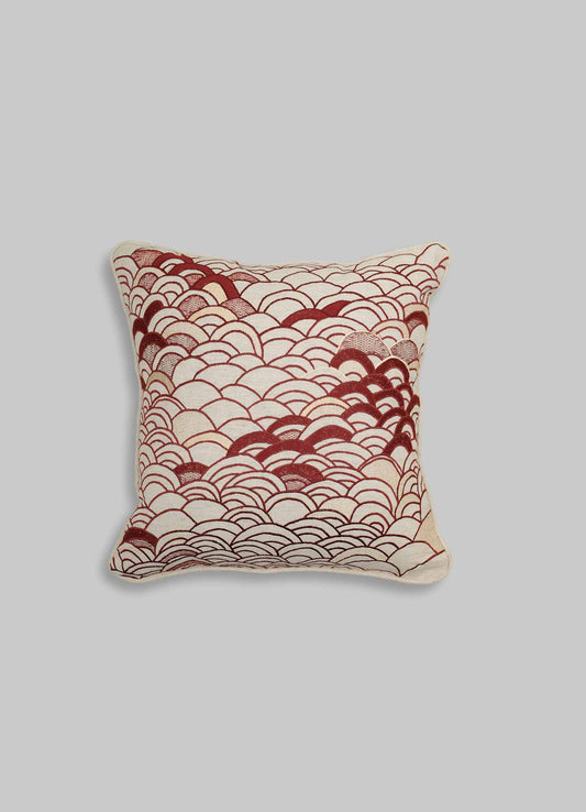 The Viya Dreamscape Red Embroidered Cushion Cover B 18"x18" features overlapping maroon scallop patterns on a white background, evoking traditional textile motifs, and is displayed on a plain light gray surface.