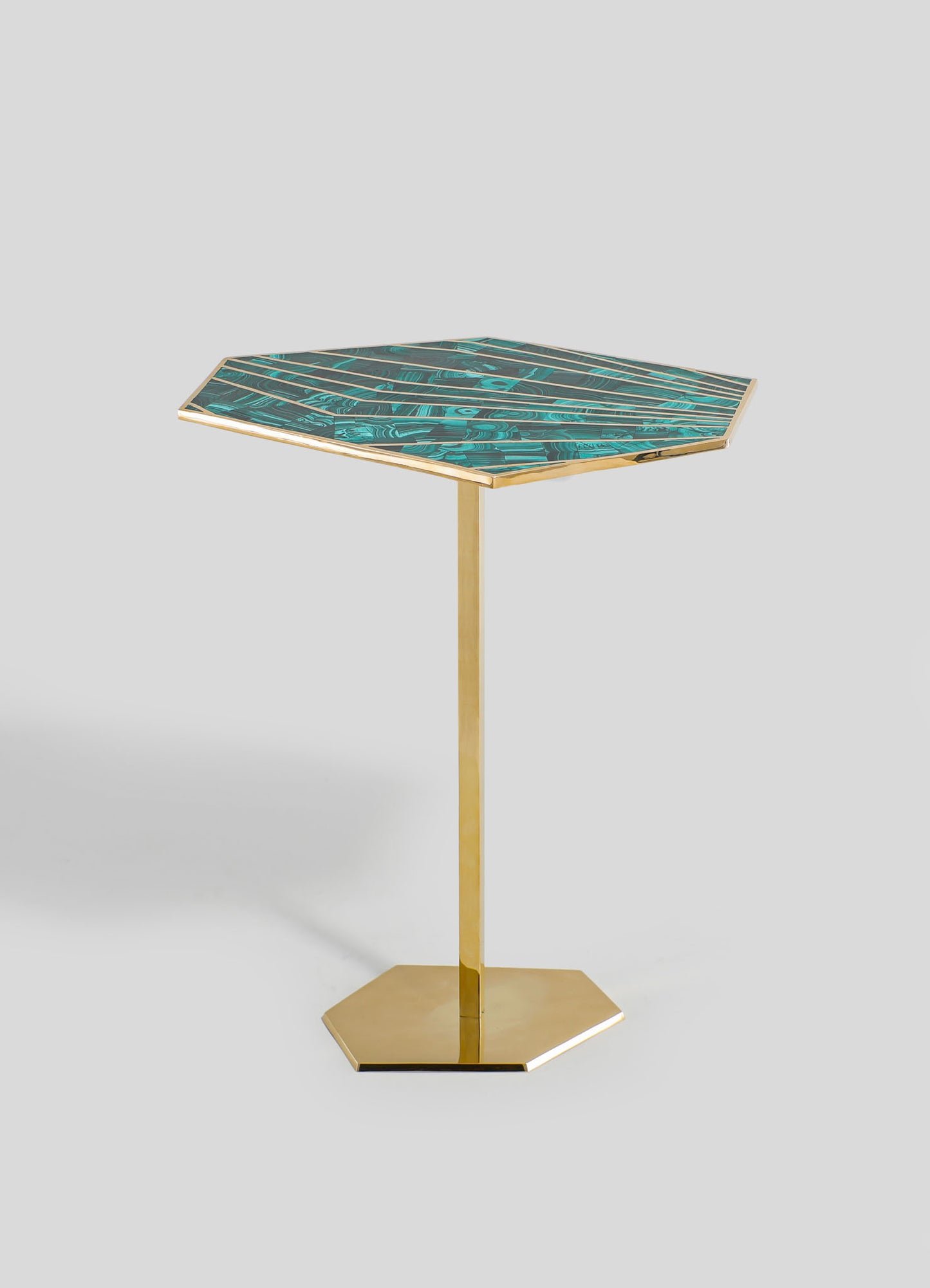 A side table with a square top featuring a turquoise and black marbled pattern, framed by a metallic gold edge, supported by a gold metal pedestal base on a flat hexagonal gold platform.