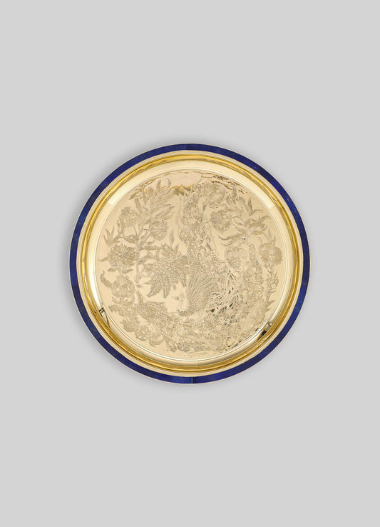 A decorative brass tray with engraved floral and phoenix motifs, featuring a deep blue enamel rim and a polished gold finish.