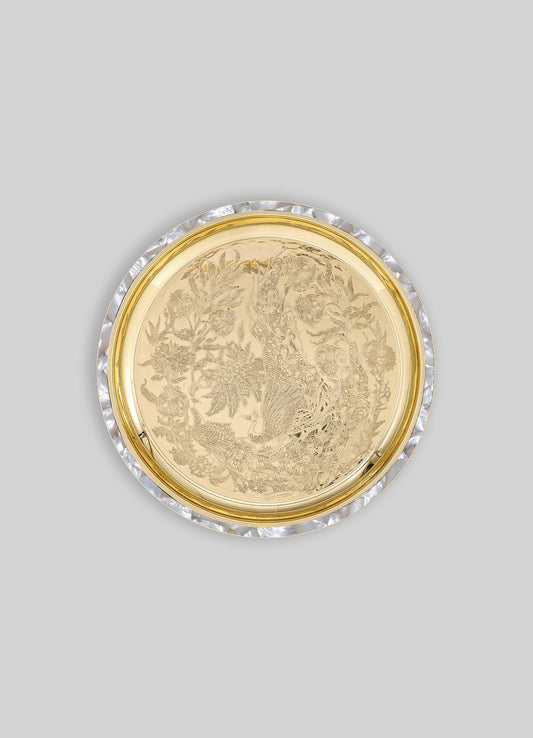 Golden glass tray with intricate engraved floral and peacock motifs, bordered by a pearl-like shell edge.