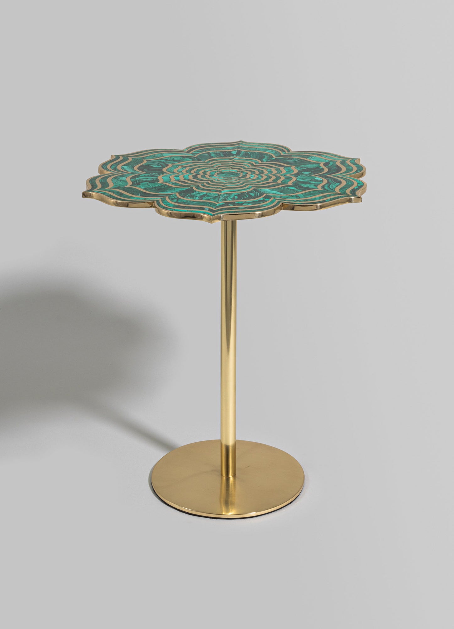 A decorative side table with a floral-shaped top featuring intricate turquoise and gold geometric patterns, mounted on a slender gold metal pedestal with a round base. The style appears modern and luxurious, with a focus on detailed craftsmanship and bold colors.