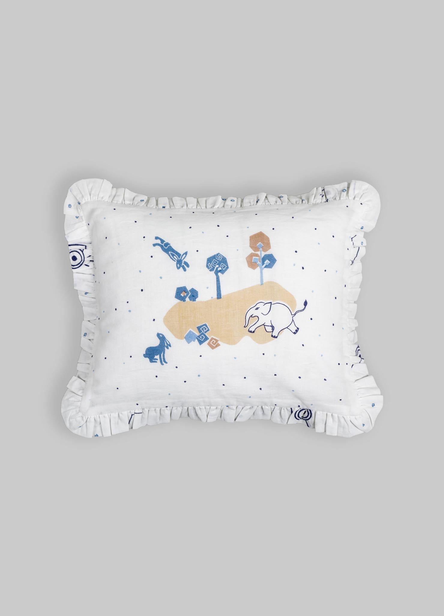 Cotton decorative pillow with embroidered animal and tree motifs in shades of blue, beige, and white, featuring a ruffled fabric border.
