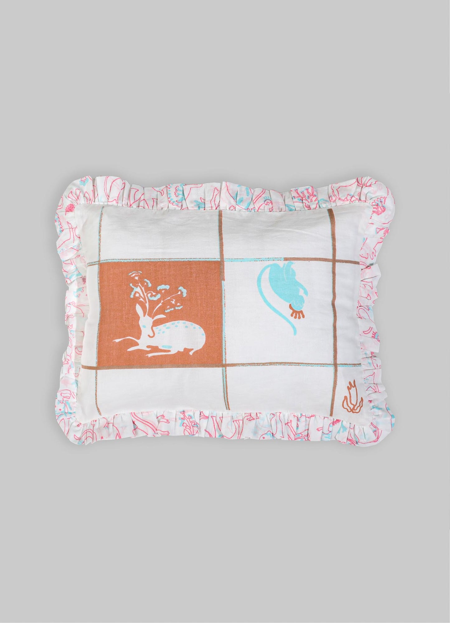 Cotton decorative cushion with a patchwork design featuring stylized floral and animal motifs in pastel blue and terracotta on a white background, edged with a ruffled floral print border.