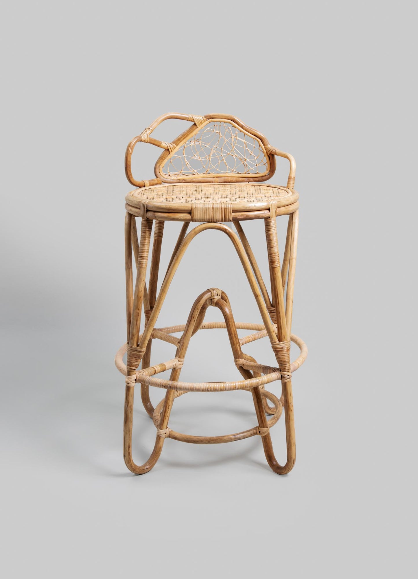 Wicker bar stools with rounded seats and intricate woven backrests, crafted from natural rattan with a light beige finish. The design features smooth, curved lines and a rustic, handcrafted style suitable for casual or coastal interiors.