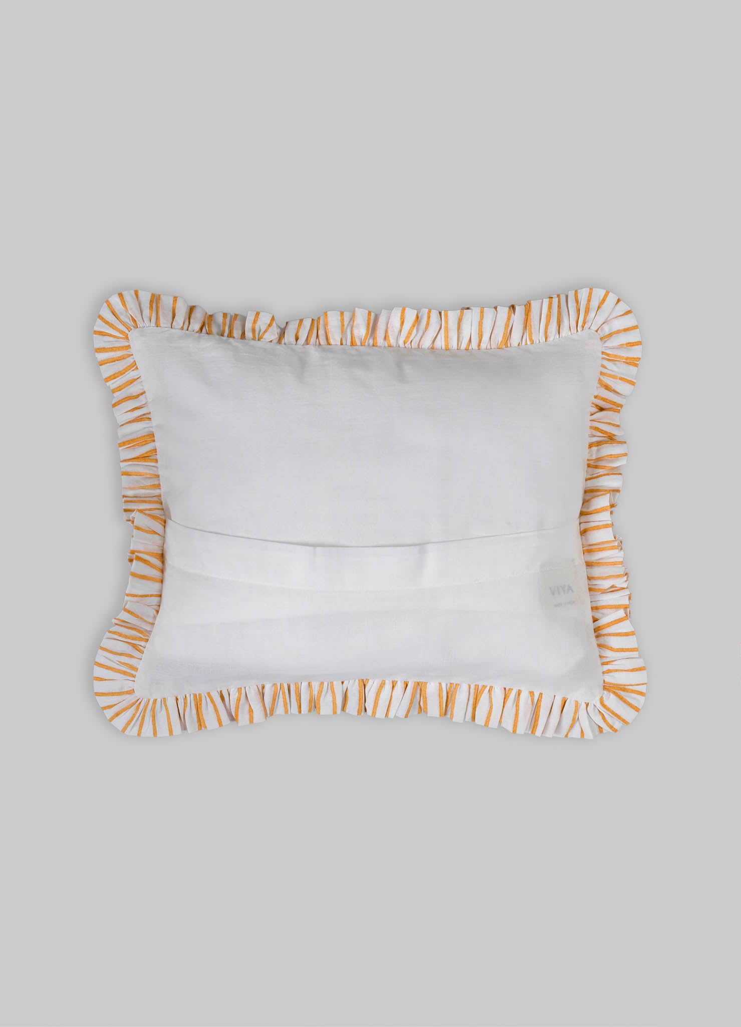 Decorative rectangular cushion with white fabric and orange striped ruffled border.