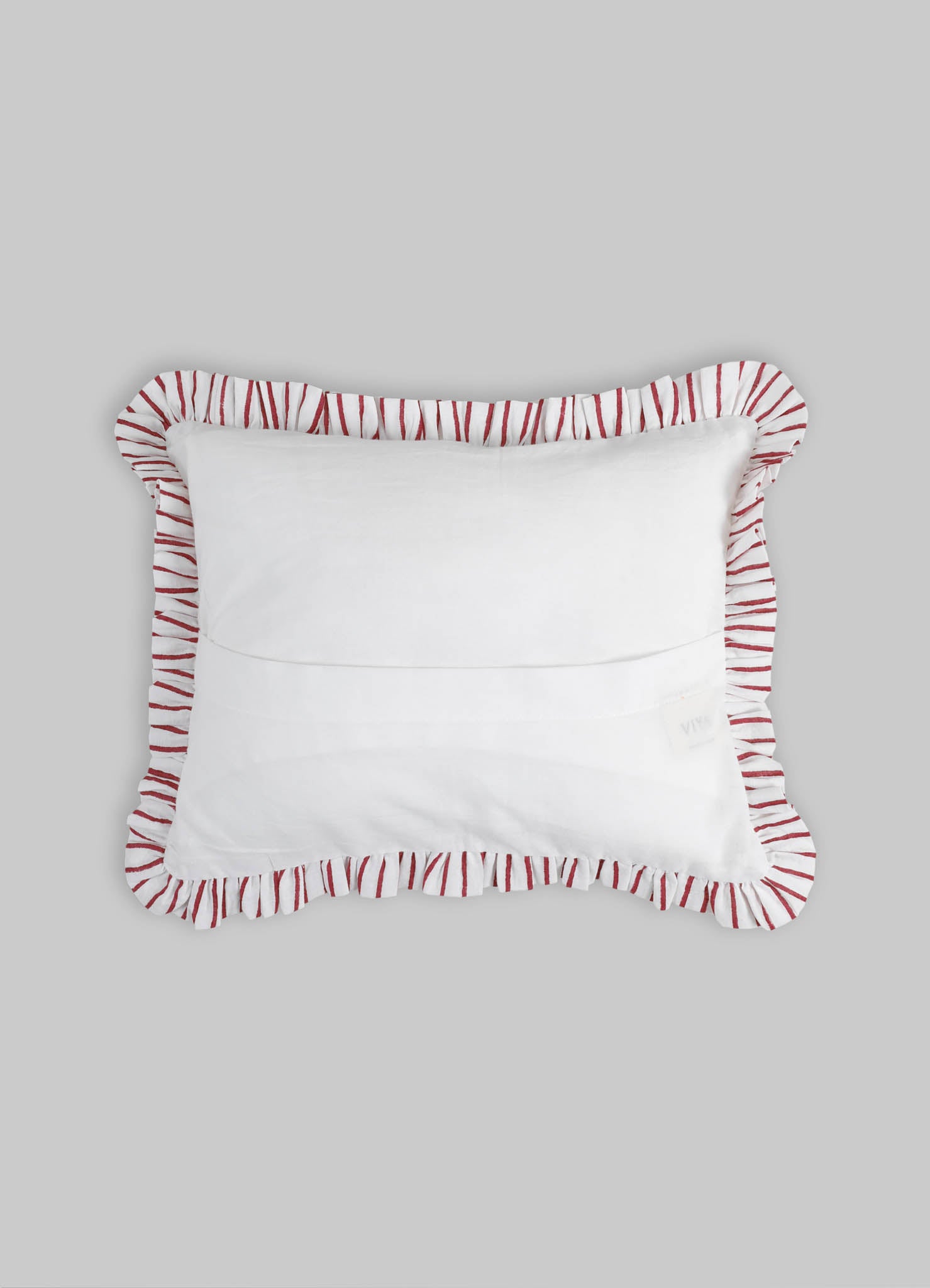Rectangular cushion with white fabric and a ruffled border featuring red and white striped pattern, designed for decorative or comfort use.