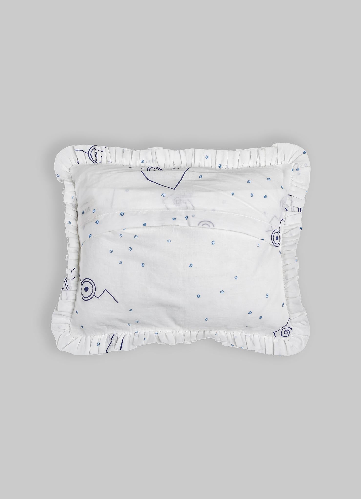 White textile cushion with a ruffled edge and a subtle abstract pattern in navy blue, featuring small circular and line motifs on soft fabric. The cushion has a crafted, handcrafted style with a minimalist and contemporary design.