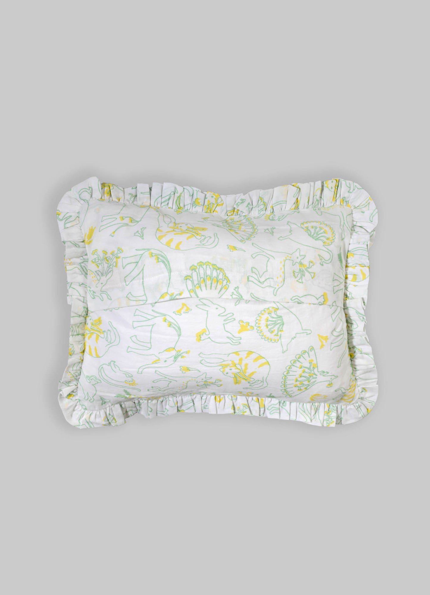 Cotton pillowcase with a floral and animal print pattern in yellow and green tones, featuring ruffled edges.