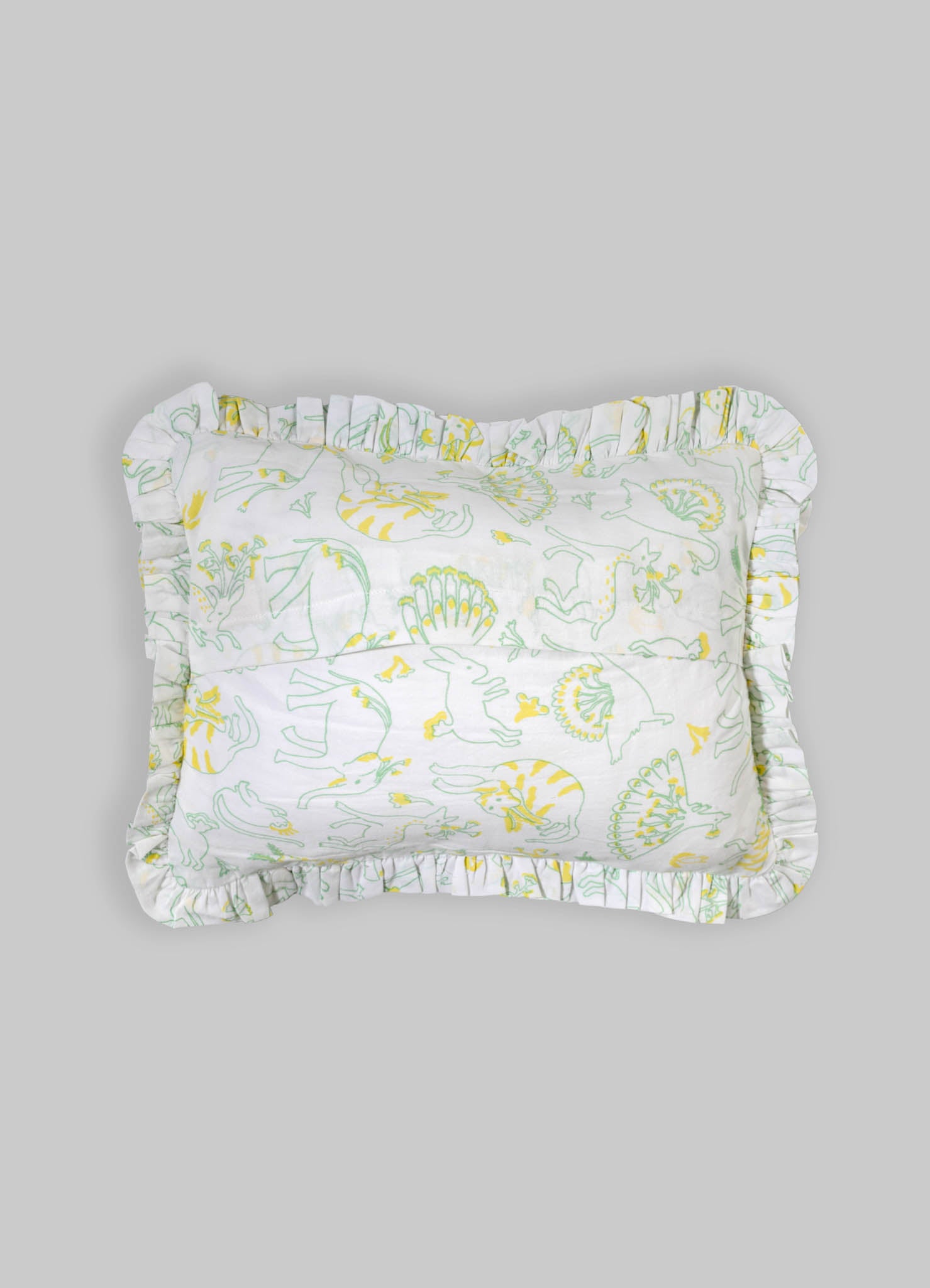 Cotton pillowcase with a floral and animal print pattern in yellow and green tones, featuring ruffled edges.