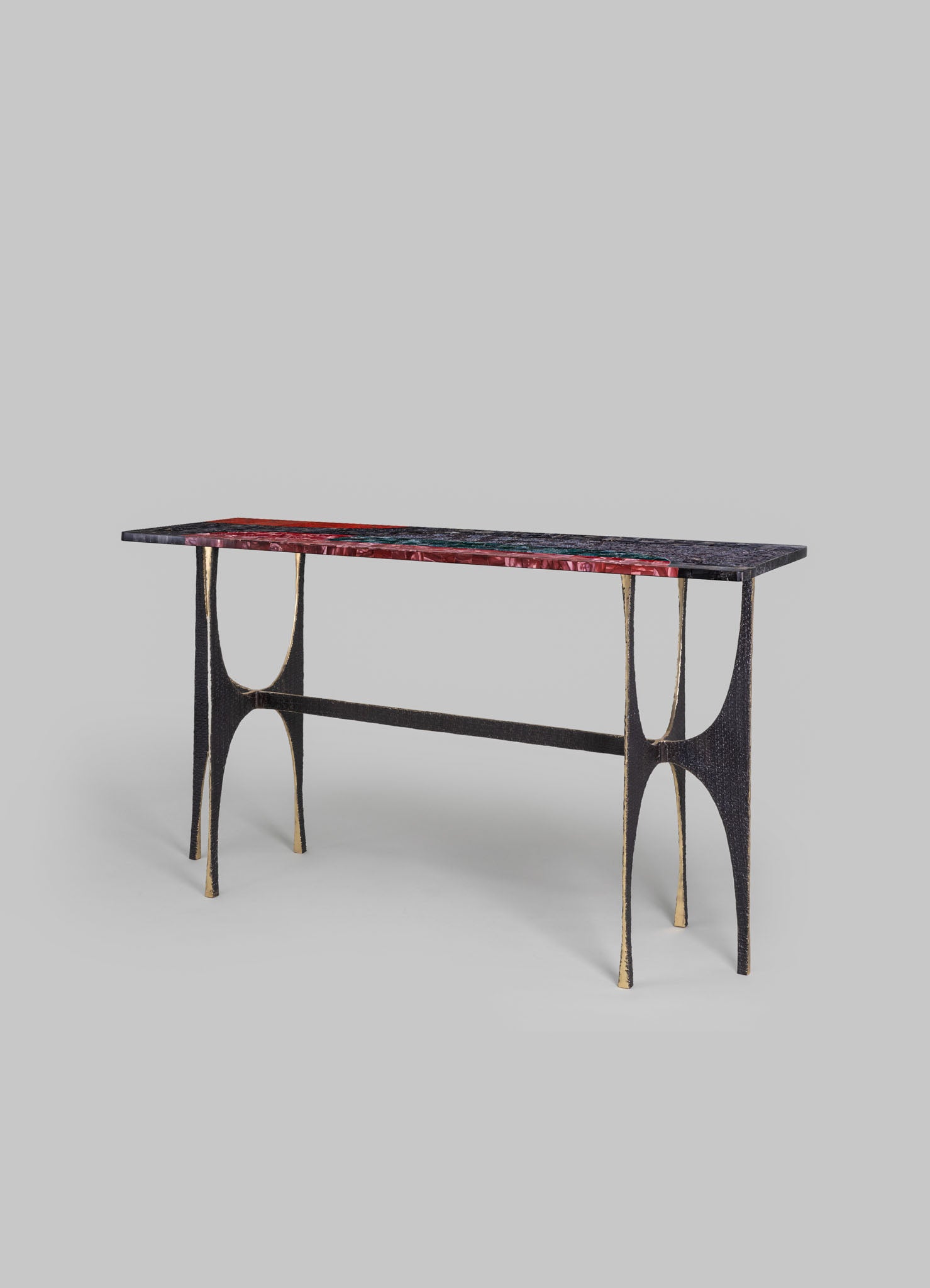 Wooden console table with a black finish and gold accents, featuring a marble top with red, black, and grey veining, in a contemporary style.