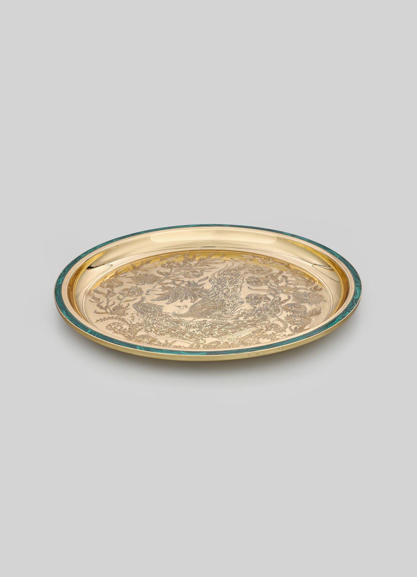 Decorative round brass tray with engraved floral and bird motifs, featuring a gold-tone finish and a contrasting teal rim.