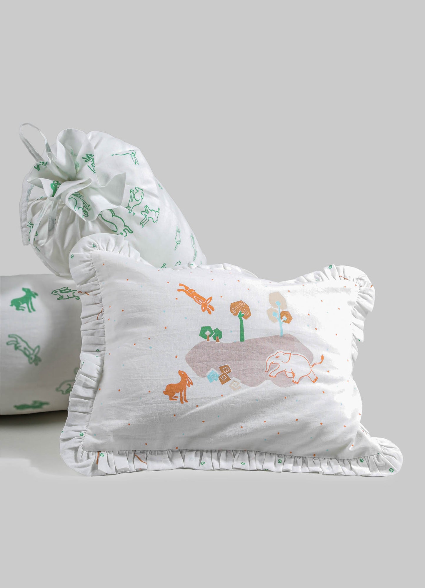 Cotton pillowcases with ruffled edges, featuring playful animal and nature motifs in pastel colors on a white background. The fabric appears lightweight and soft, designed for children's bedding or decorative use.