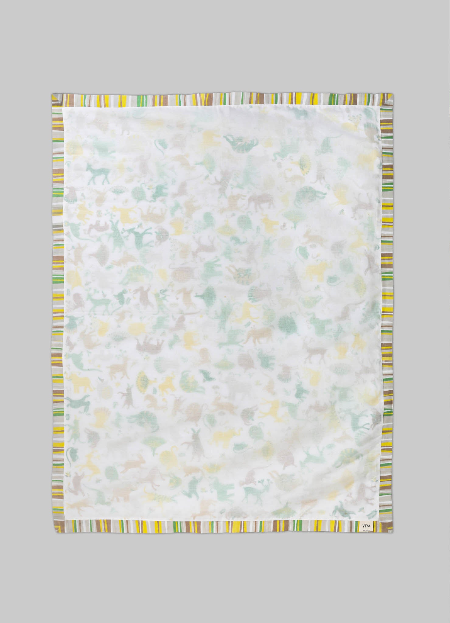 Cotton baby blanket with a multicolored striped border and a subtle animal print pattern in pastel shades of yellow, green, and beige on a white background.