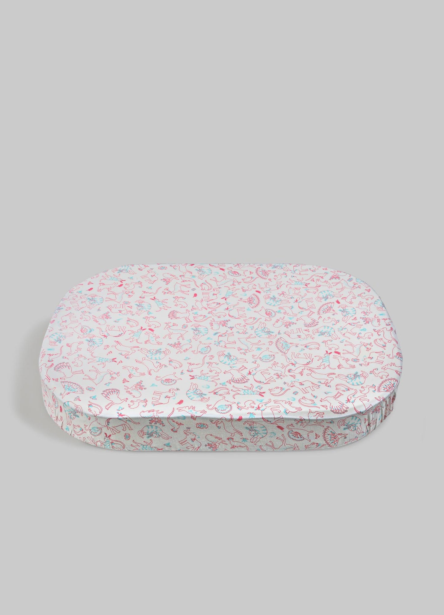 Round cushion with a printed fabric cover featuring playful pink and blue line drawings of animals, set against a light gray background. The cushion has a soft appearance and a ruffled edge detail.