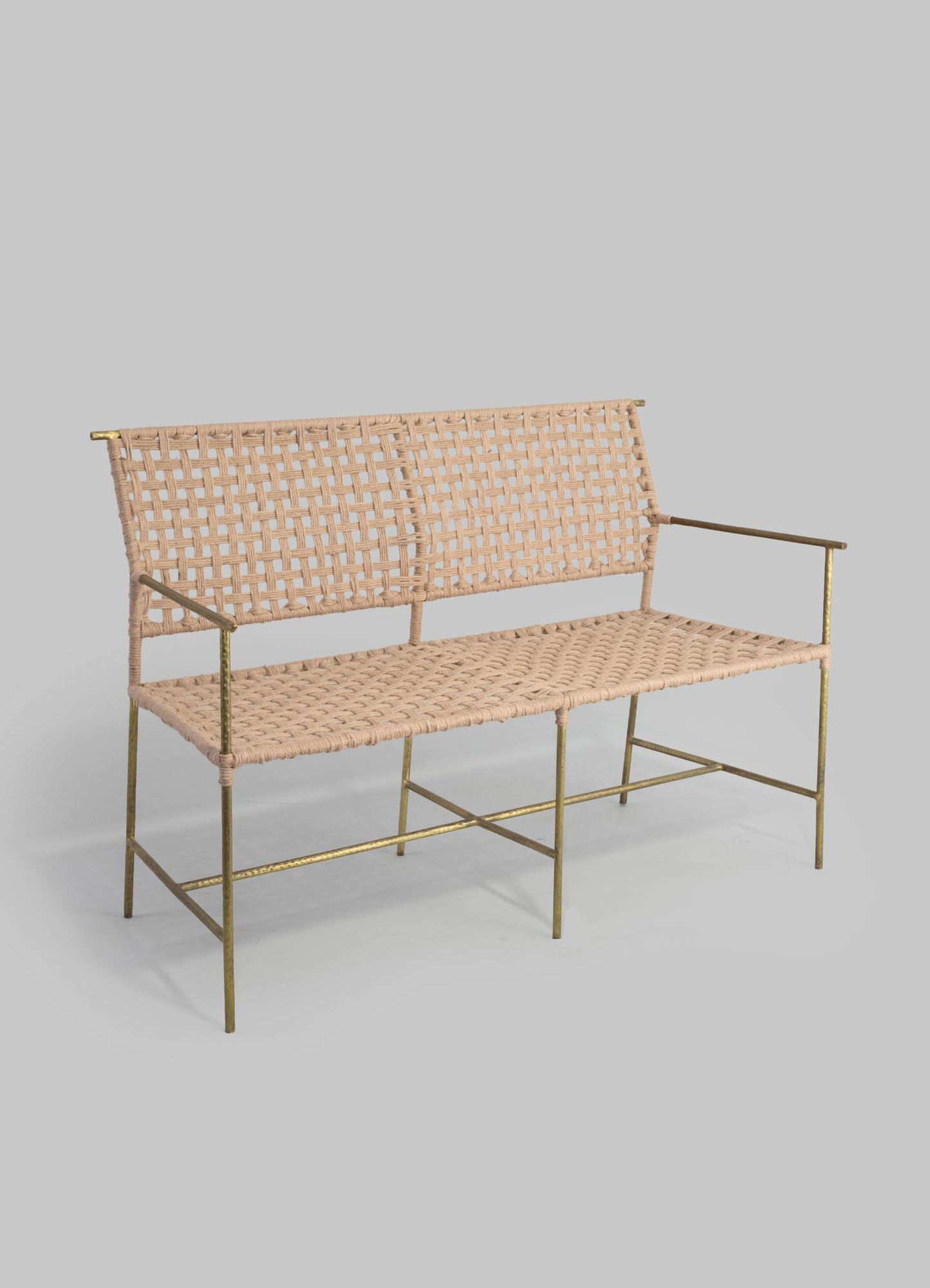 Woven rattan bench with a beige finish and gold-toned metal frame, featuring a lattice pattern on the backrest and seat, with slim armrests and a minimalist design.