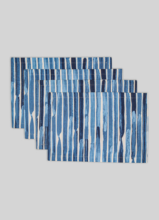 Set of four rectangular table runners with a vertical striped pattern in shades of blue and white on a light gray background. Made of fabric with a textured appearance, suitable for contemporary or casual tabletop decor.