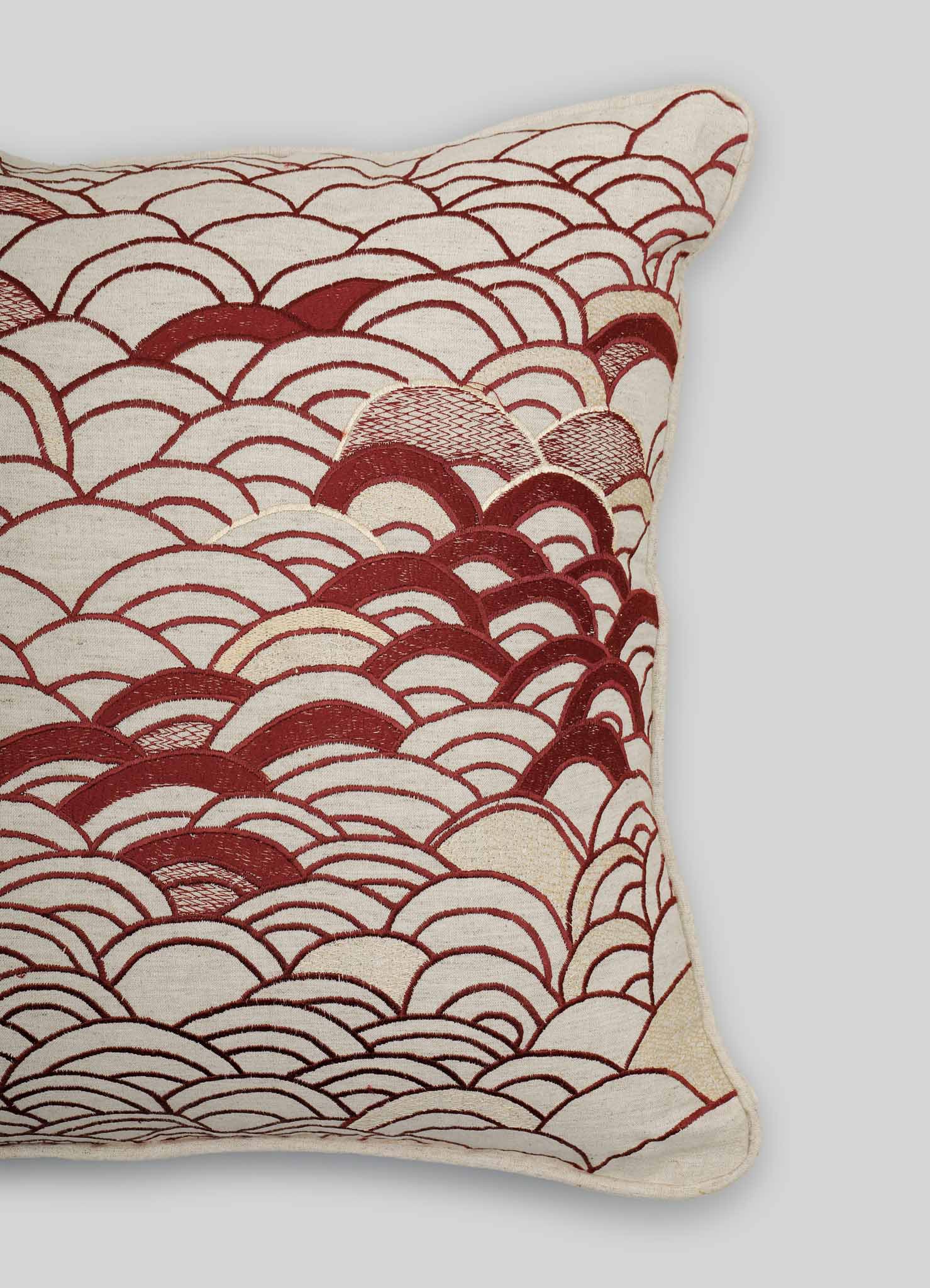 The Viya Dreamscape Red Embroidered Cushion Cover B (18"x18") shows a maroon wave and arch motif on cream, inspired by embroidered textiles. Only the right side is visible against a plain light gray background.