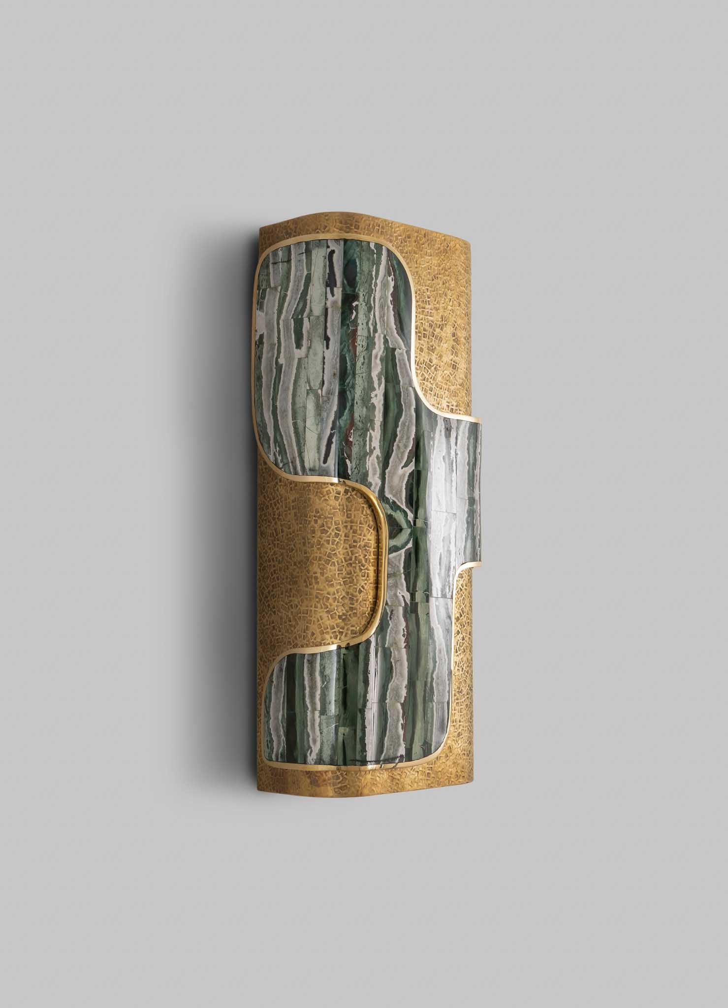 Decorative wall panel combining green and white marble with natural stone veining, framed by gold-tone metal accents, featuring an abstract, curved design.