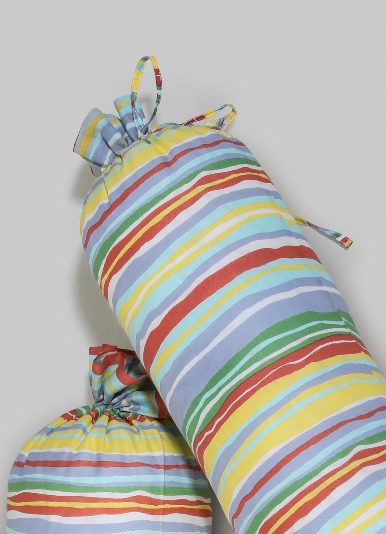 Colorful striped fabric bedding set with a pattern of horizontal lines in red, yellow, blue, green, and white, made from a soft, lightweight material. The set includes a duvet cover and matching pillowcases, styled in a casual, cheerful design suitable for a bedroom or guestroom.