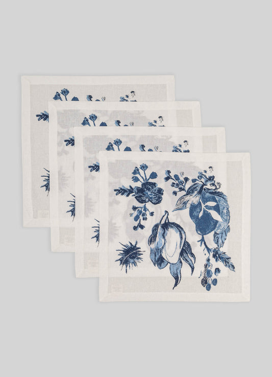 Set of five white linen napkins with blue floral prints, featuring botanical motifs and a delicate border, arranged on a light gray background.