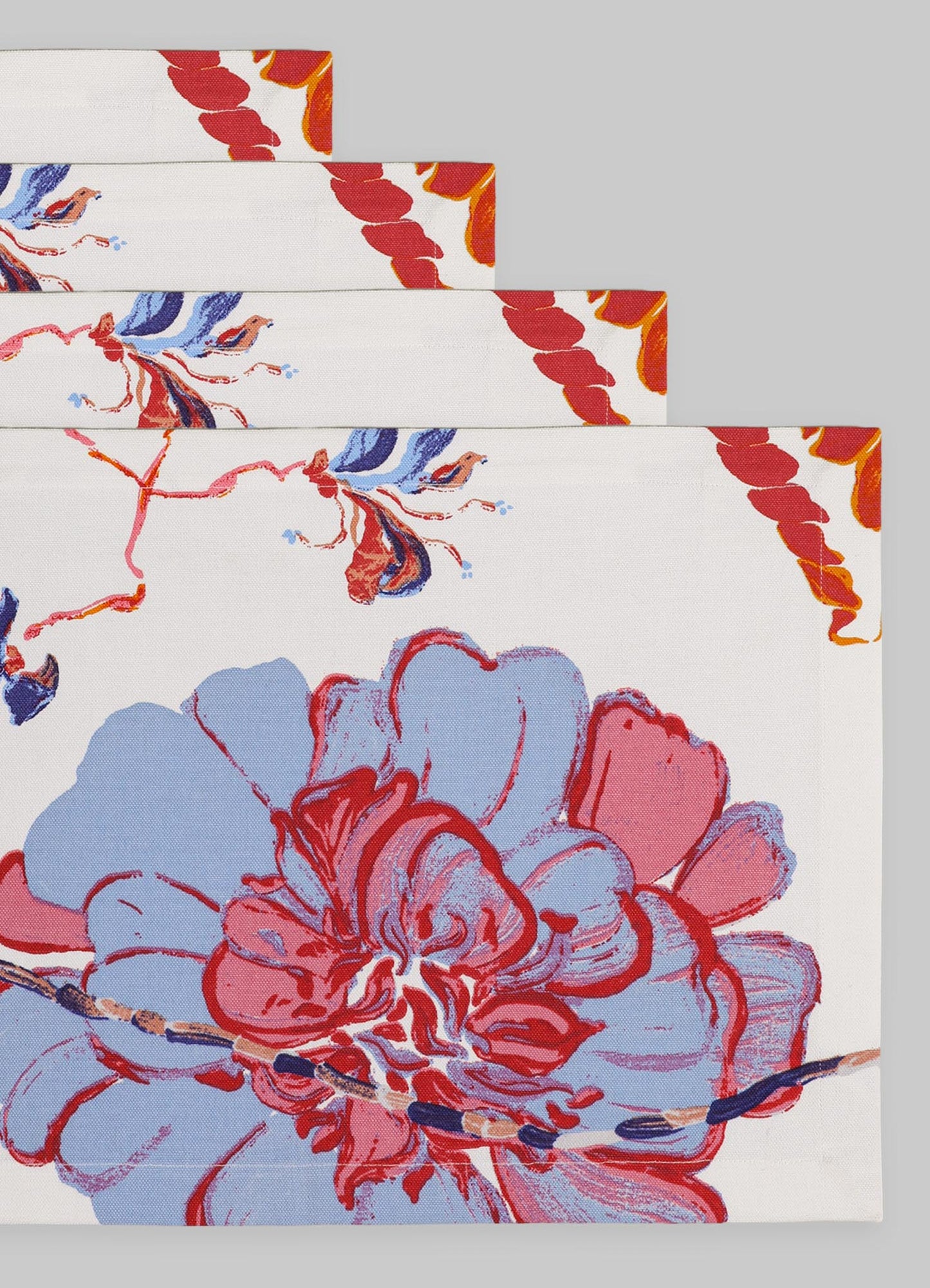 Decorative textile with floral and abstract motifs in shades of red, pink, blue, and orange on a white background, made from lightweight fabric suitable for table linen or home decor. The design features large stylized flowers and flowing patterns, creating a vibrant, artistic style.