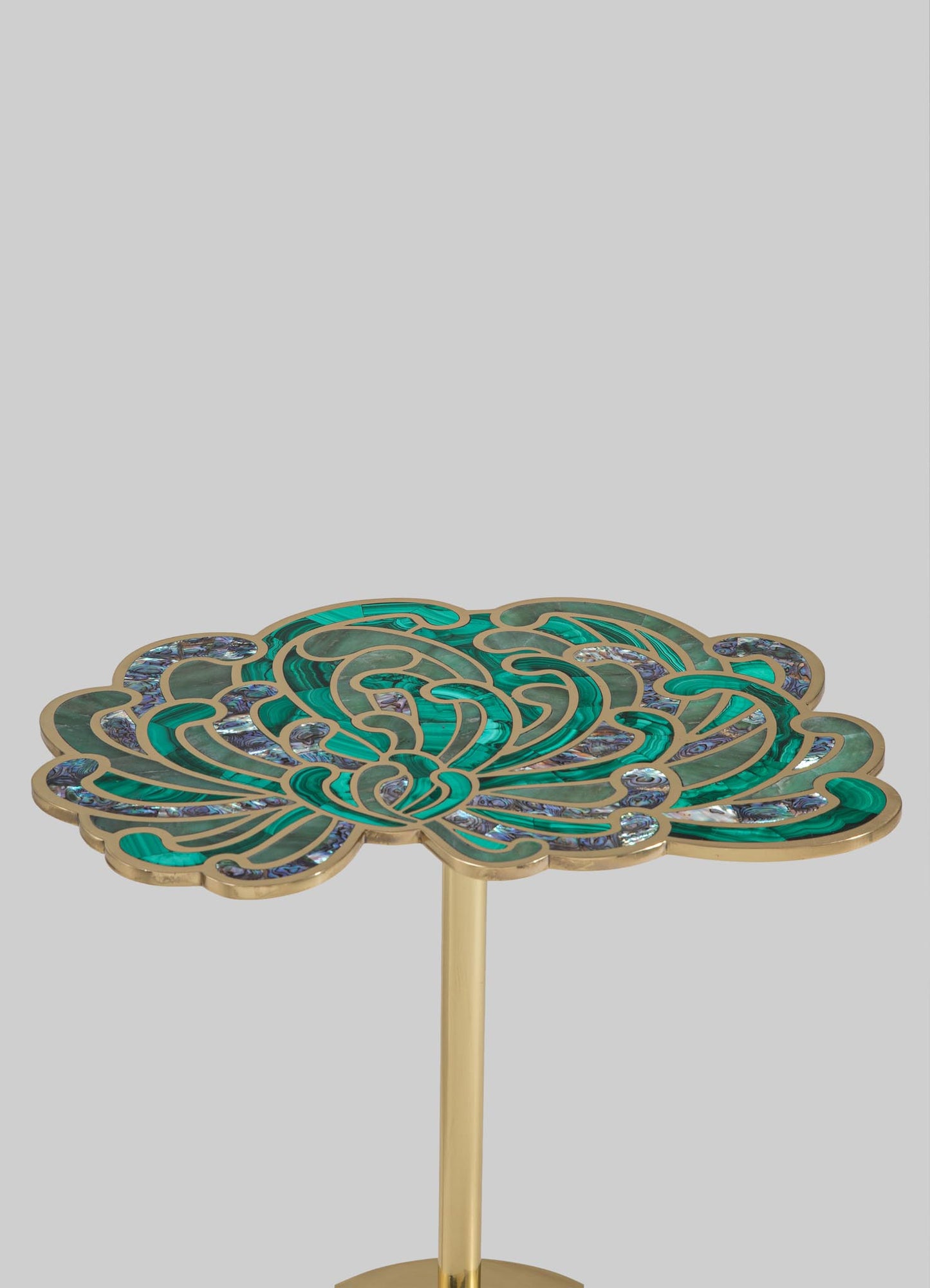 A decorative side table with a floral-inspired top featuring intricate patterns in shades of teal, blue, and purple, framed with gold-tone metal. The table has a slender gold pedestal base that completes its elegant, artistic style.