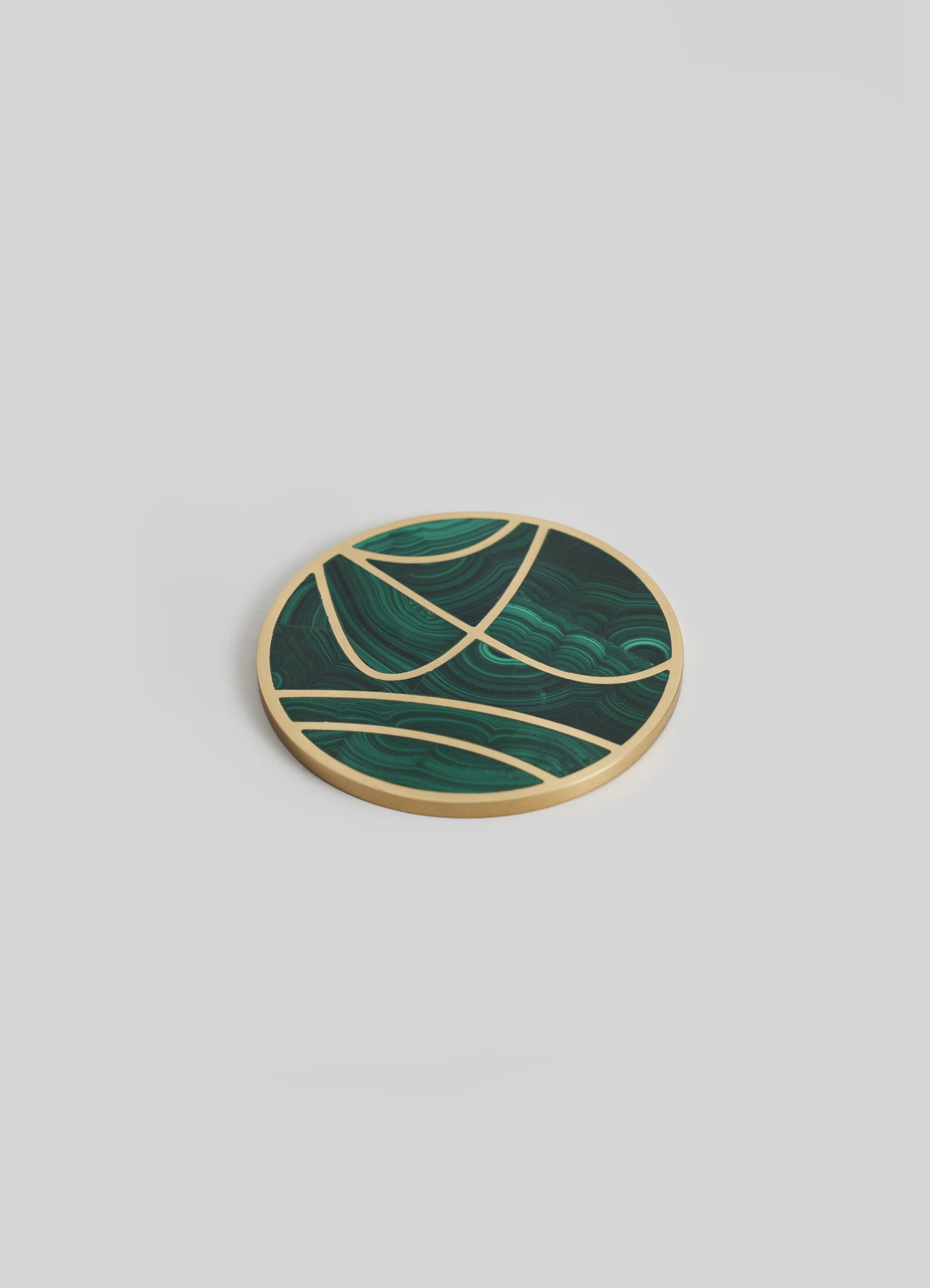 A round decorative tray with a gold-colored border and an abstract pattern of green and dark green swirling lines and shapes. The tray has a contemporary style with a smooth finish.