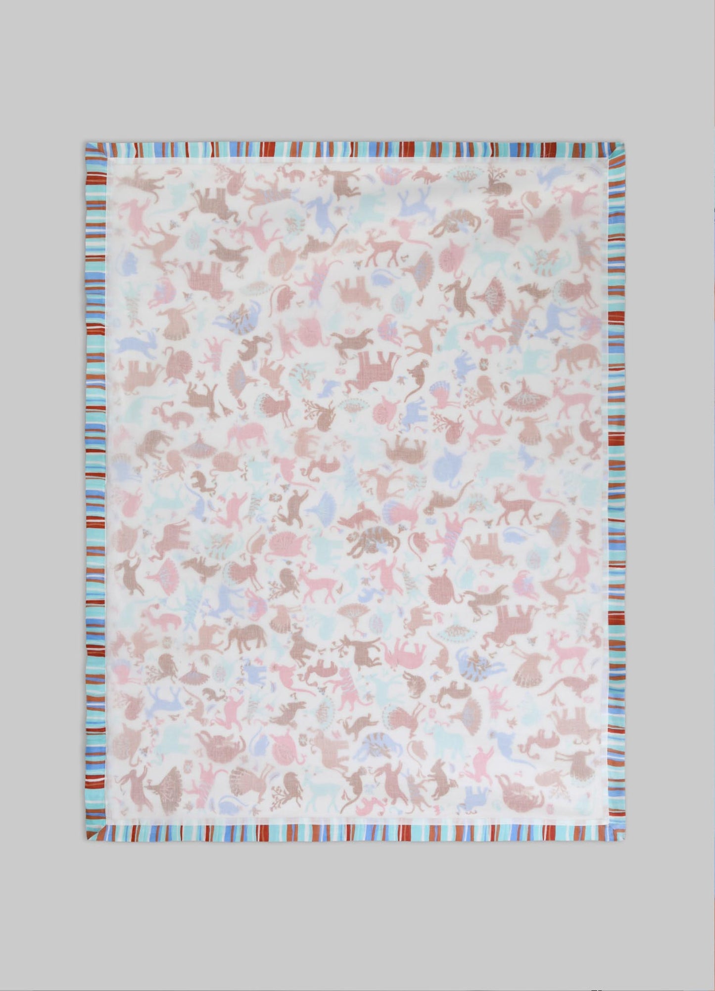 Cotton tablecloth with a pastel-colored animal and floral motif, featuring a striped border in shades of blue, brown, and red. The style is casual and decorative, suitable for a contemporary or playful table setting.