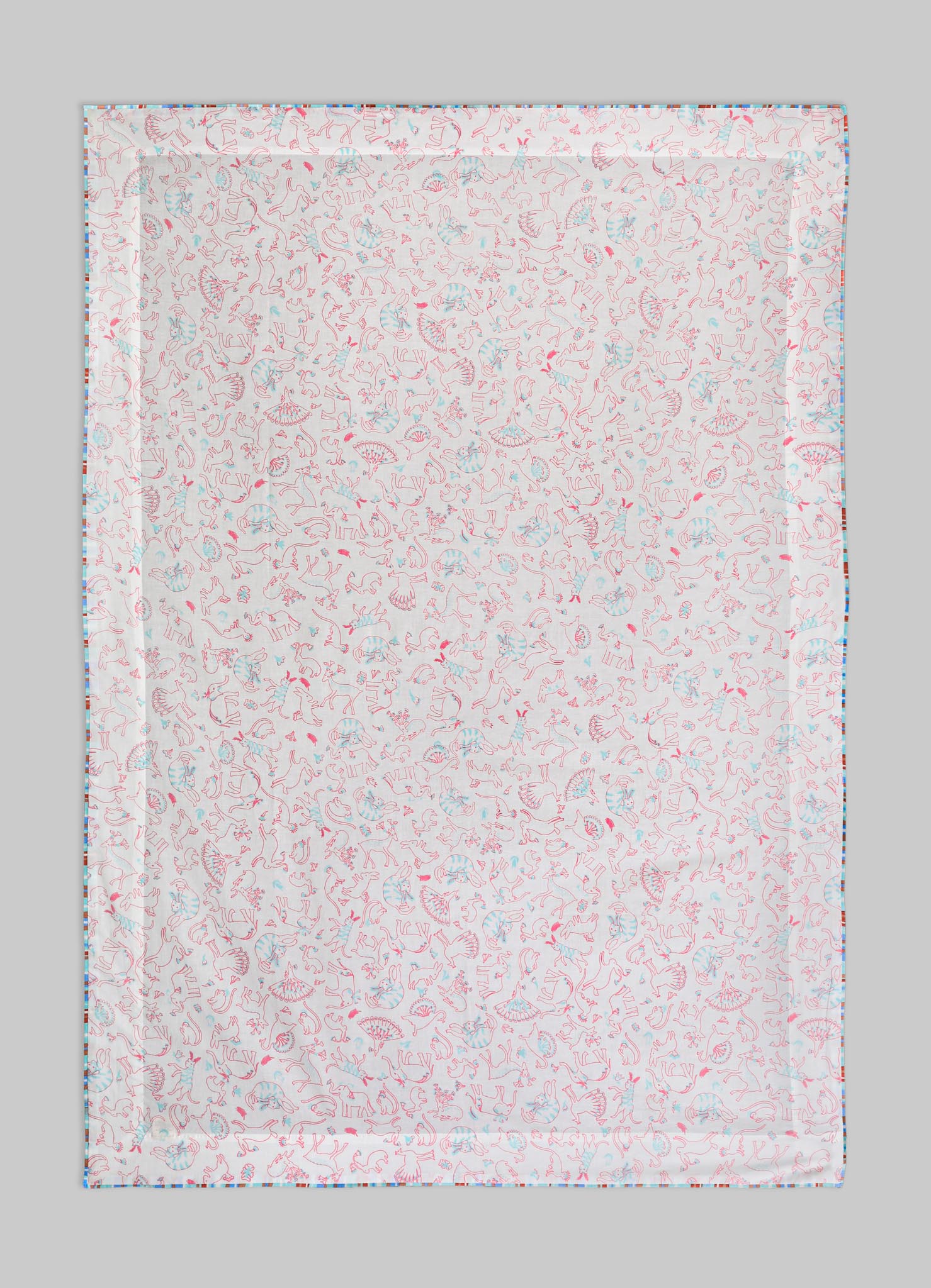 Patterned textile with a white background featuring pink and light blue line drawings of animals and floral motifs, bordered by a colorful geometric trim. The fabric appears to be lightweight, suitable for quilting, upholstery, or home decor.
