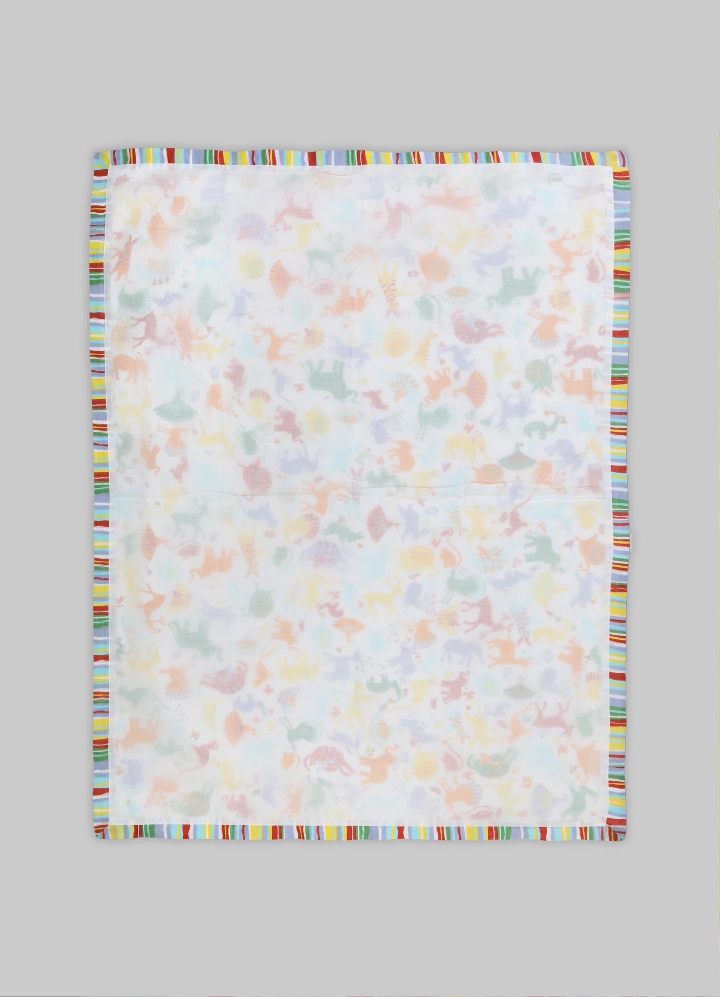 A lightweight baby blanket with a pastel animal print featuring dinosaurs, bordered with colorful striped trim.