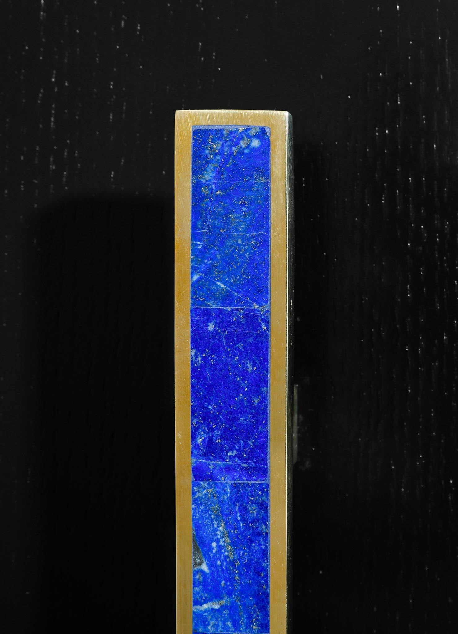 stone handle with brass inlay
