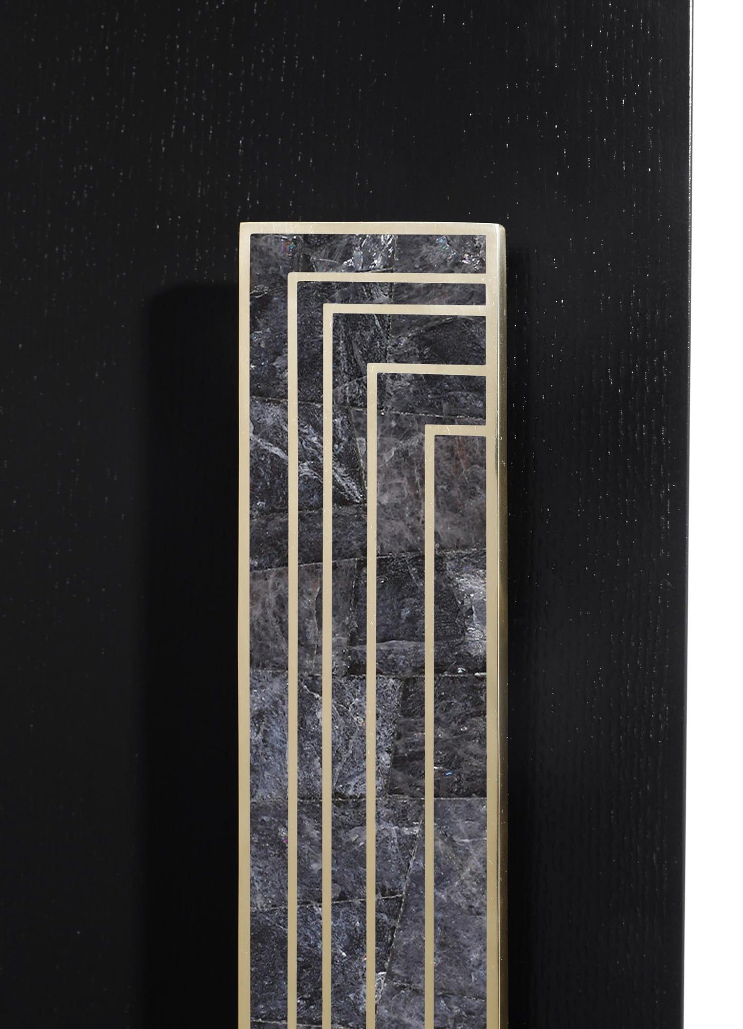 A decorative tile or panel featuring black marble with white veining, framed by slim metallic gold borders arranged in a geometric, nested rectangular pattern, set against a black textured background.