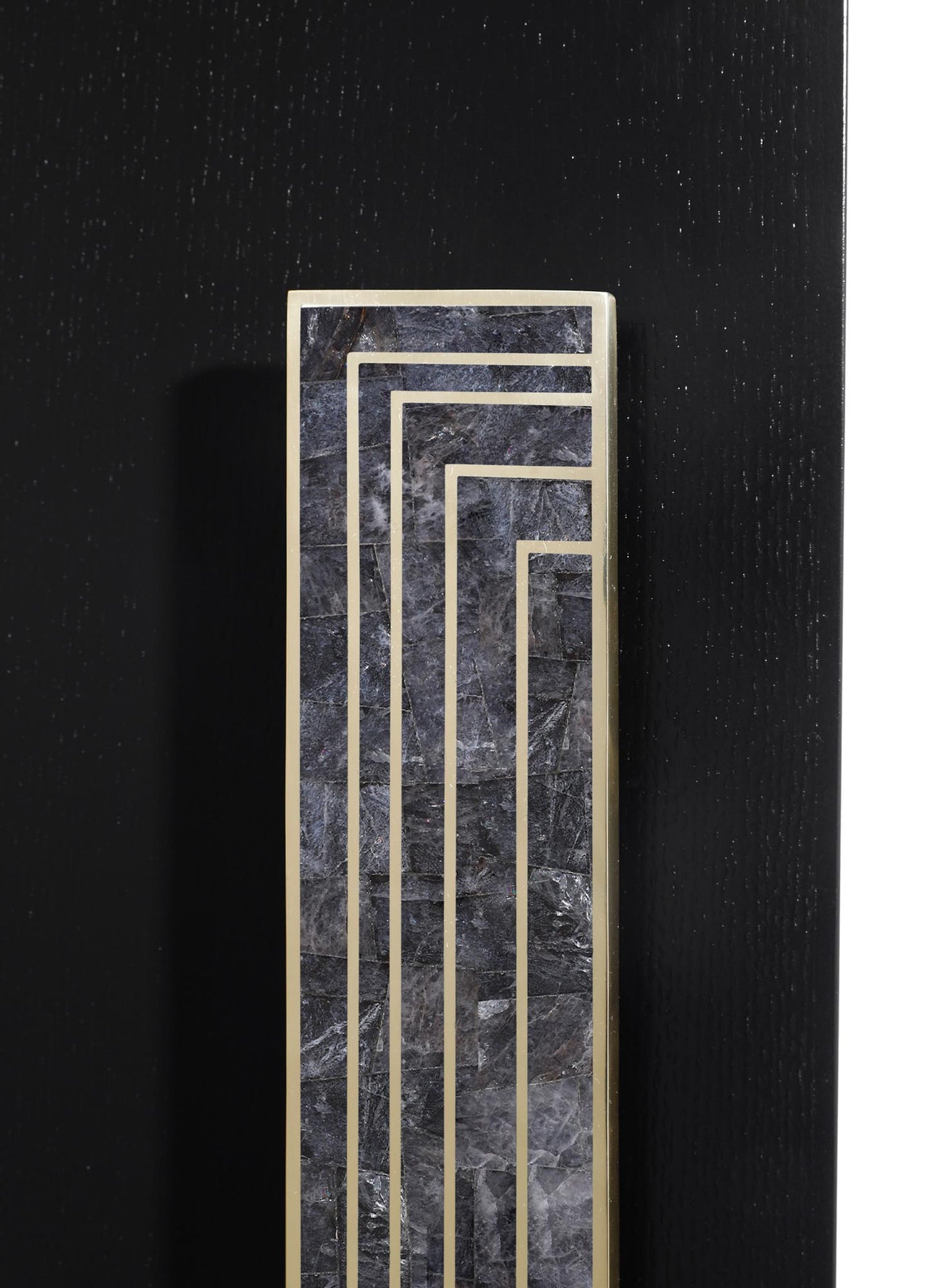 A decorative panel featuring dark gray marble with white veining and gold metal geometric lines, mounted on a black textured background. The design combines luxurious materials with a contemporary, minimalist style.