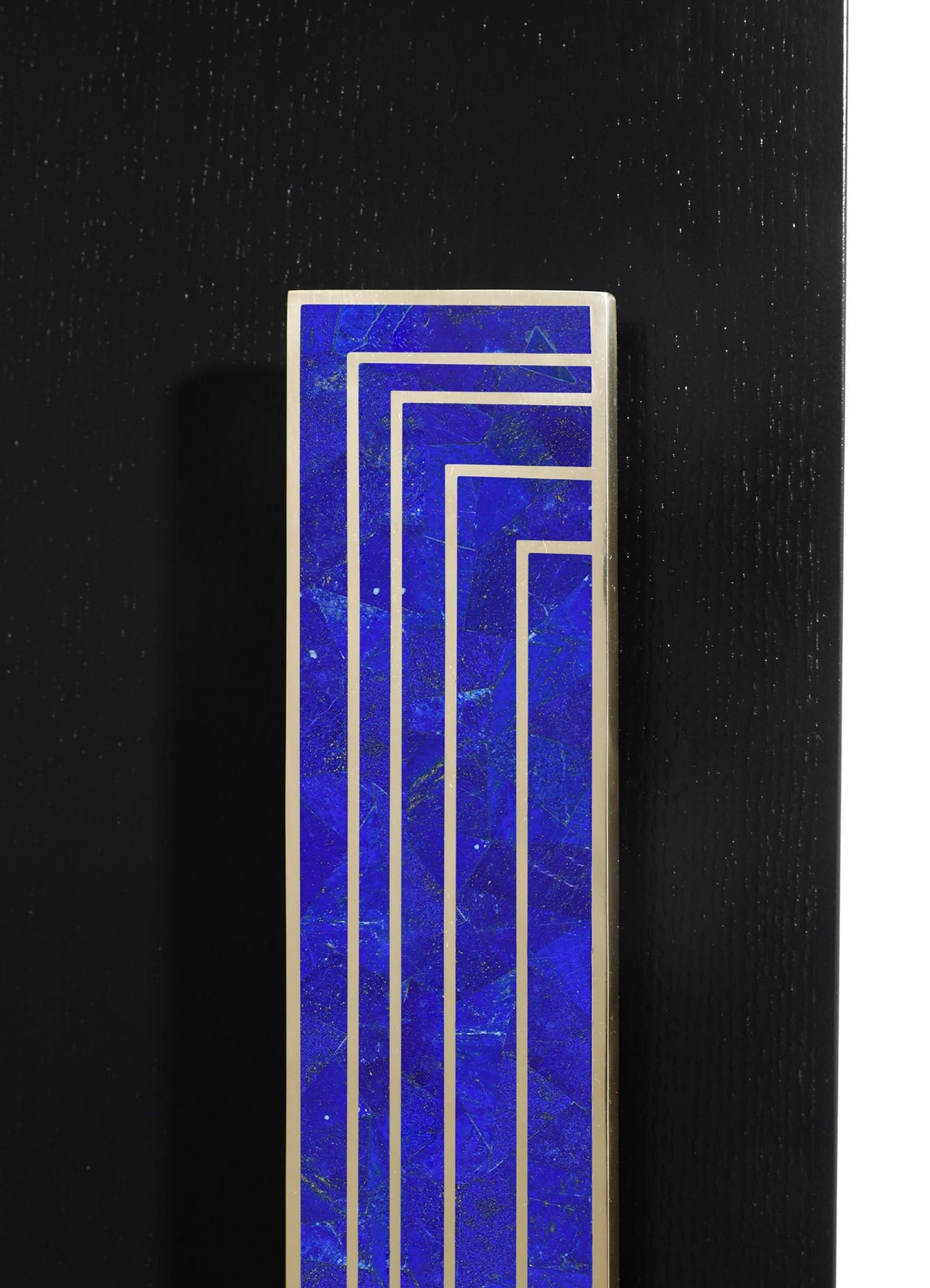 A rectangular box with a blue marble pattern and gold geometric lines, set against a black background.