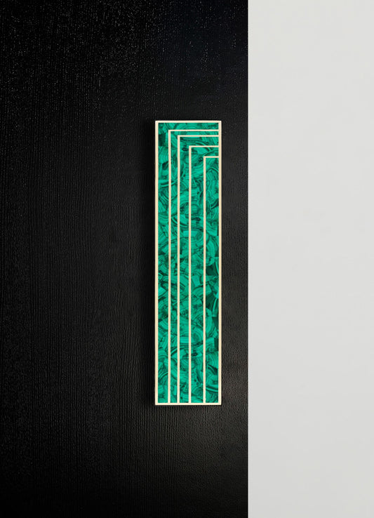 A tall, rectangular wall art piece featuring a marbled green and black pattern with white linear accents, mounted on a textured black wall. The artwork has a contemporary style with geometric and abstract motifs.
