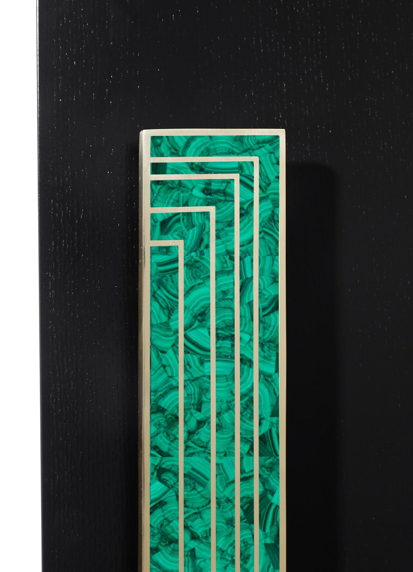 A decorative metal grille with a geometric pattern and a green marbled finish, mounted on a white frame, set against a black background.