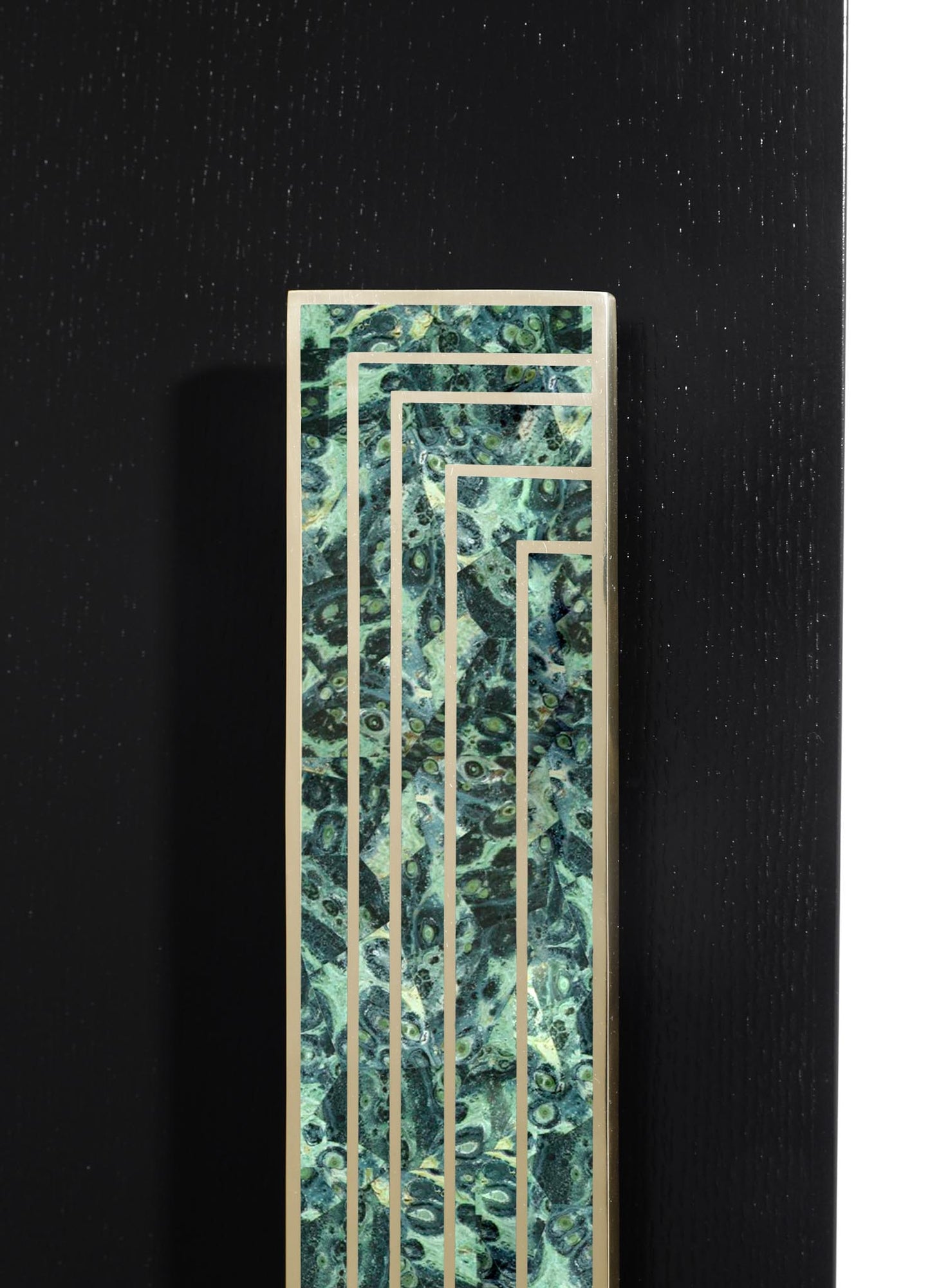 A decorative panel with a geometric pattern composed of rectangular cutouts, featuring a marbled surface in shades of green, blue, and black, framed by a metallic border.