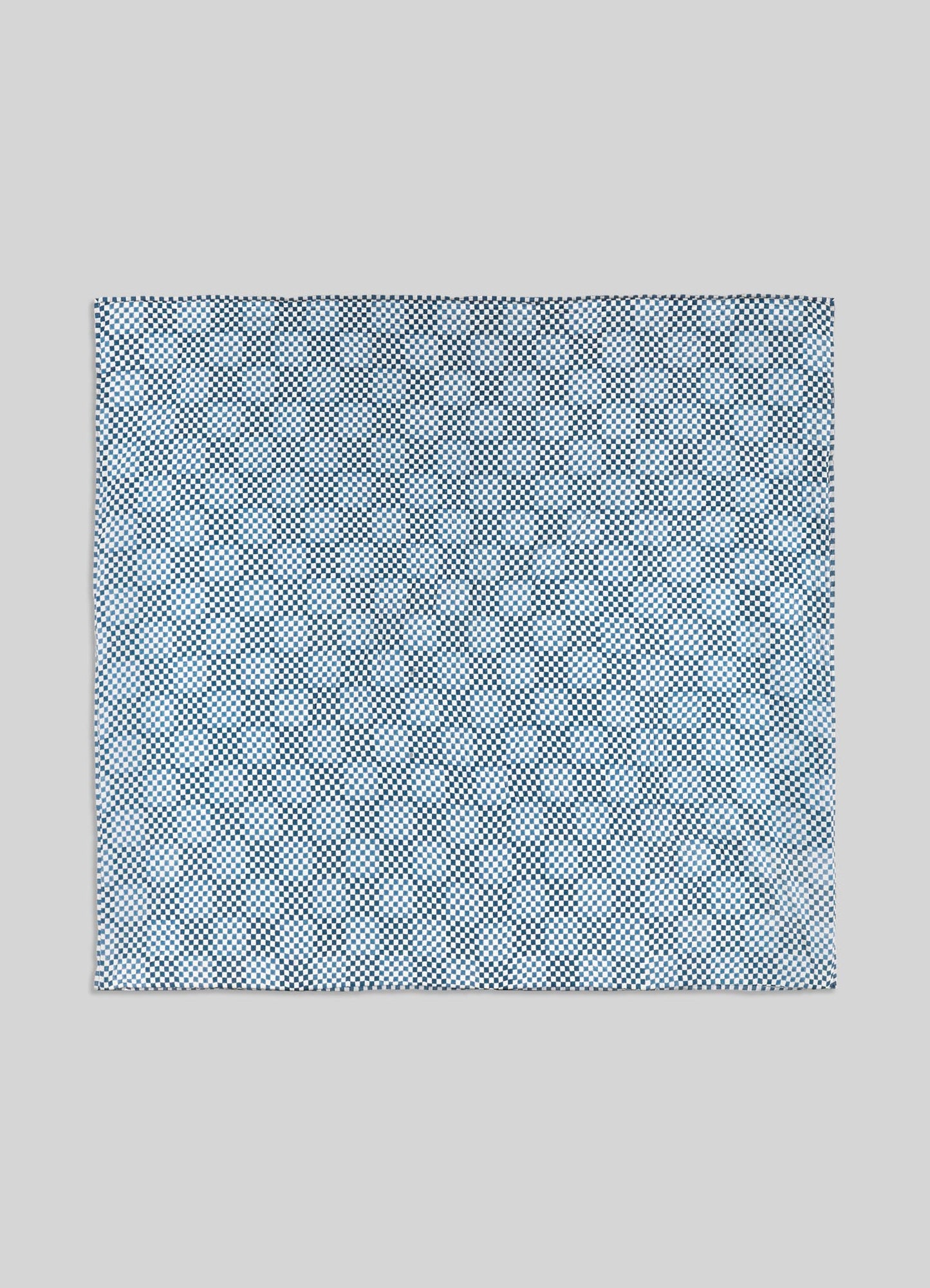 Blue patterned pocket square on a light gray background luxury king size quilts viya