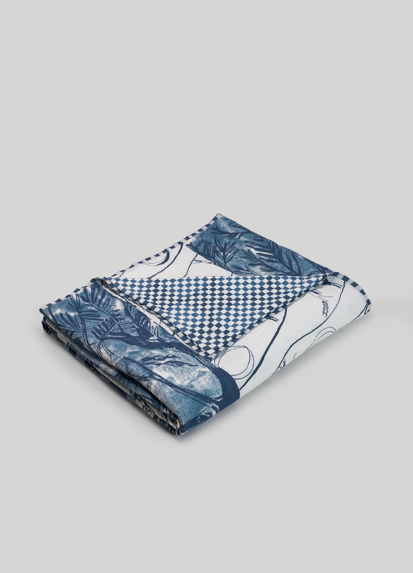 Folded fabric with blue and white patterns luxury king size quilts viya